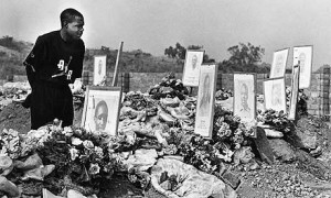 Kalusha Bwalya at the graves of Zambian national team